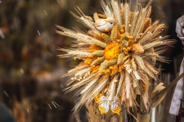 Traditional Lithuanian Easter palm made of dried flowers, ears of wheat, willow, birch, pussy-willow and juniper branches, that is then blessed in churches across Lithuania on Easter Sunday, close up