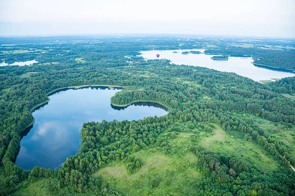 stock image Hot Air Balloon Flight over Trakai. Trakai, Vilnius, Lithuania, surrounded by beautiful islands, lakes, forests, wilderness, nature in summer at sunset, aerial view with reflections of the sky