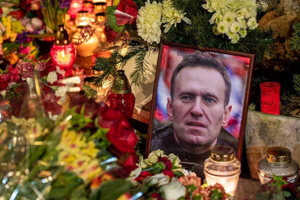 stock image Vilnius, Lithuania - February 19 2024: Flowers and candles laid at spontaneous memorial for Russian opposition leader Alexei Navalny, who died in a remote penal colony in Kharp