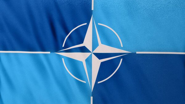 Kiev, Ukraine - February 25th 2022: NATO military alliance flag closeup UHD flag banner background, 3d illustration. Realistic North Atlantic Treaty Organization Flag backdrop banner waving in wind.