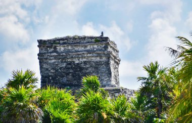 The Mayan citadel of Tulum on Caribbean SeaTulum was built to be a harbor fortress, on ocean cliffs, providing protection from the East and a limestone wall surrounding rest of city on three sides