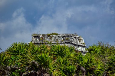The Mayan citadel of Tulum on Caribbean SeaTulum was built to be a harbor fortress, on ocean cliffs, providing protection from the East and a limestone wall surrounding rest of city on three sides