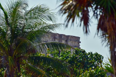 The Mayan citadel of Tulum on Caribbean SeaTulum was built to be a harbor fortress, on ocean cliffs, providing protection from the East and a limestone wall surrounding rest of city on three sides
