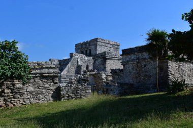 The Mayan citadel of Tulum on Caribbean SeaTulum was built to be a harbor fortress, on ocean cliffs, providing protection from the East and a limestone wall surrounding rest of city on three sides