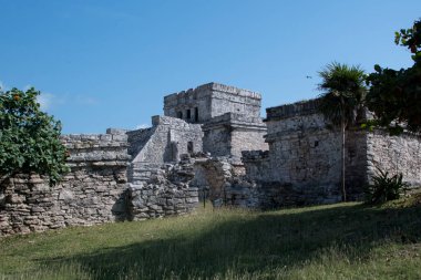 The Mayan citadel of Tulum on Caribbean SeaTulum was built to be a harbor fortress, on ocean cliffs, providing protection from the East and a limestone wall surrounding rest of city on three sides