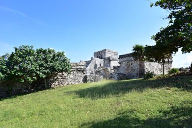 The Mayan citadel of Tulum on Caribbean SeaTulum was built to be a harbor fortress, on ocean cliffs, providing protection from the East and a limestone wall surrounding rest of city on three sides