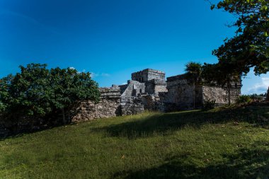 The Mayan citadel of Tulum on Caribbean SeaTulum was built to be a harbor fortress, on ocean cliffs, providing protection from the East and a limestone wall surrounding rest of city on three sides