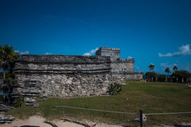 The Mayan citadel of Tulum on Caribbean SeaTulum was built to be a harbor fortress, on ocean cliffs, providing protection from the East and a limestone wall surrounding rest of city on three sides