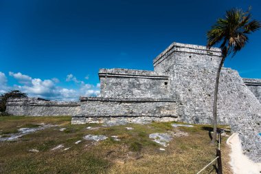 The Mayan citadel of Tulum on Caribbean SeaTulum was built to be a harbor fortress, on ocean cliffs, providing protection from the East and a limestone wall surrounding rest of city on three sides