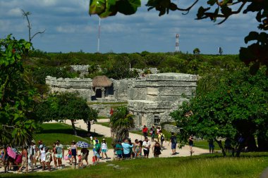 Tourists in Caribbean Sea, the jungle and Tulum fortressMost idyllic and impressive places in Latin America are turquoise sea,Caribbean beaches,jungle and Tulum fortress