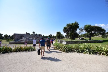 Tourists in Caribbean Sea, the jungle and Tulum fortressMost idyllic and impressive places in Latin America are turquoise sea,Caribbean beaches,jungle and Tulum fortress
