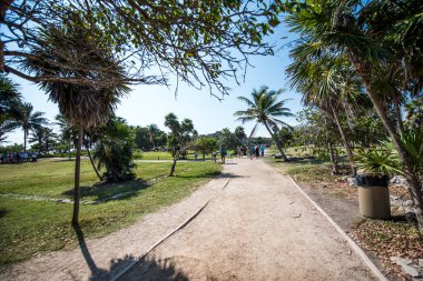 Tourists in Caribbean Sea, the jungle and Tulum fortressMost idyllic and impressive places in Latin America are turquoise sea,Caribbean beaches,jungle and Tulum fortress