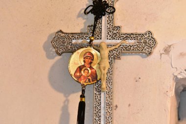 Cross on the wall of the Church of the Holy Sepulchre in Jerusalem
