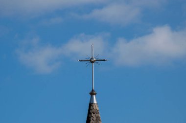  Metal Orthodox cross on church tower towards blue sky, signifies connection between heaven and earth, upward aspiration, righteousness of life illuminated by faith