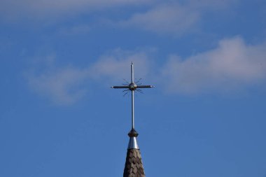  Metal Orthodox cross on church tower towards blue sky, signifies connection between heaven and earth, upward aspiration, righteousness of life illuminated by faith
