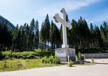 Huge Christian Orthodox cross in the mountains of the Obarsia of Lotru dedicated to the holy martyrs of Brncoveni and the holy great martyr Mina