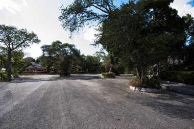 Old pavilion, terraces,traditional buildings,tropical plants in Riviera Maya, a Mexican paradise famous for its tourist base with luxury hotels and restaurants.