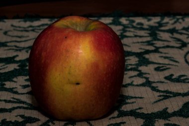 Close-up of a red and yellow apple. Macro shot