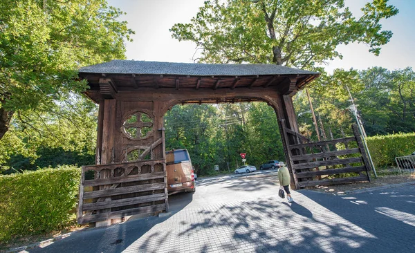 stock image Maramures Gate,built of oak wood,generally on at least three pillars carved with different Traditional floral motifs, having upper threshold of gate covered with shingles