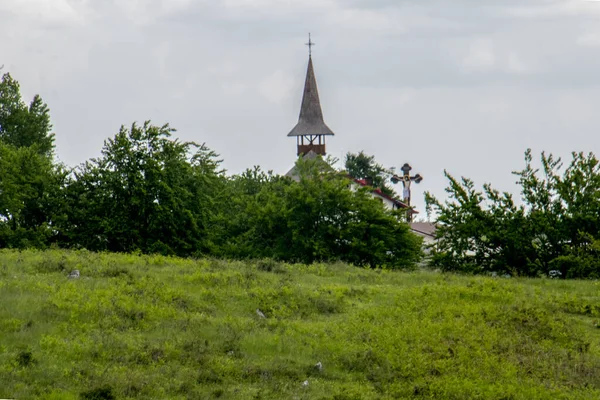 stock image The Dobrita Monastery in Gorj, with its wooden Orthodox church built in Maramuresian style, is the place of worship above the world, patronized by Saint Ilie Tesviteanul