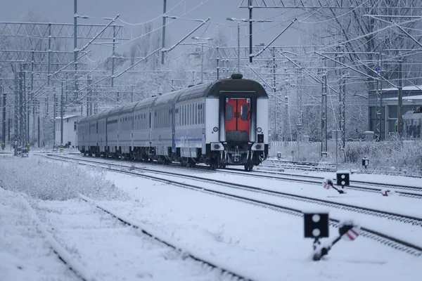 SNOWY WINTER ON THE RAILWAY - Wagons of a passenger train on a snow covered railway siding