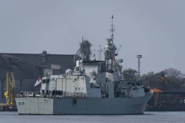 SWINOUJSCIE, WEST POMERANIAN - POLAND - 2022: A Canadian Navy frigate sails to the sea port
