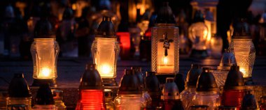CEMETERY - Grave candles on tombstones at the burial site of the dead