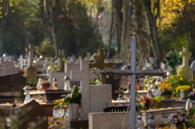 CEMETERY - Old steel crucifix and tombstones at burial site of the dead