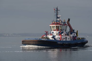 SWINOUJSCIE, WEST POMERANIAN - POLAND - 2022:  Tugboat is sailing on sea