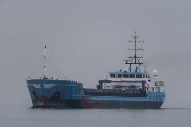 MARITIME TRANSPORT - The ship sails along waterway to port