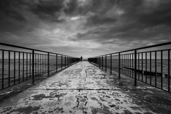 stock image PIER - Dramatic clouds over the sea coast
