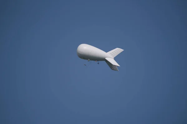 stock image AIRSHIP - Flying object against the blue sky