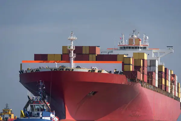 MARITIME TRANSPORT -  A huge container ship sails with cargo to the port