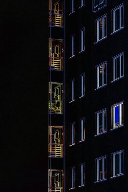 ARCHITECTURE - Building at night with light in the windows clipart