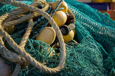 FISHING PORT -  Fishing nets deposited on the quay clipart
