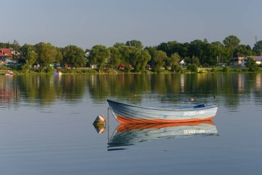 CZAPLINEK, WEST POMERANIAN - POLAND - JULY 23, 2024:Small rowing  boat on the lake clipart