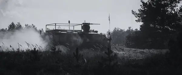 stock image INFANTRY FIGHTING VEHICLE - Armoured personnel carrier drives through forest off-road terrain