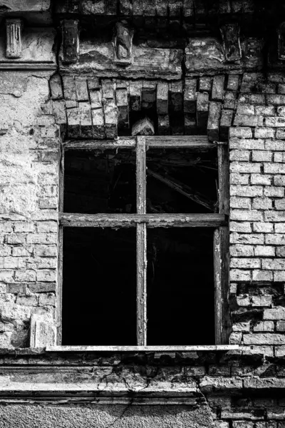 stock image A VERY OLD HOUSE - A window in a neglected and dilapidated brick building