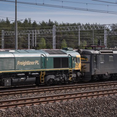 SWINOUJSCIE, WEST POMERANIAN - POLAND - MAY 17, 2022: The locomotives are standing on railway siding clipart