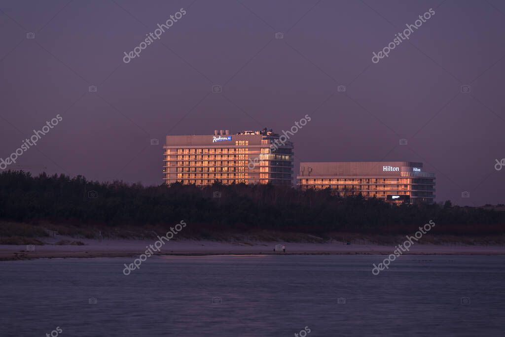 SWINOUJSCIE, WEST POMERANIAN - POLAND - MARCH 17, 2025: SEA COAST AND RESORTS - RADISSON and HILTON hotels in the sunrise