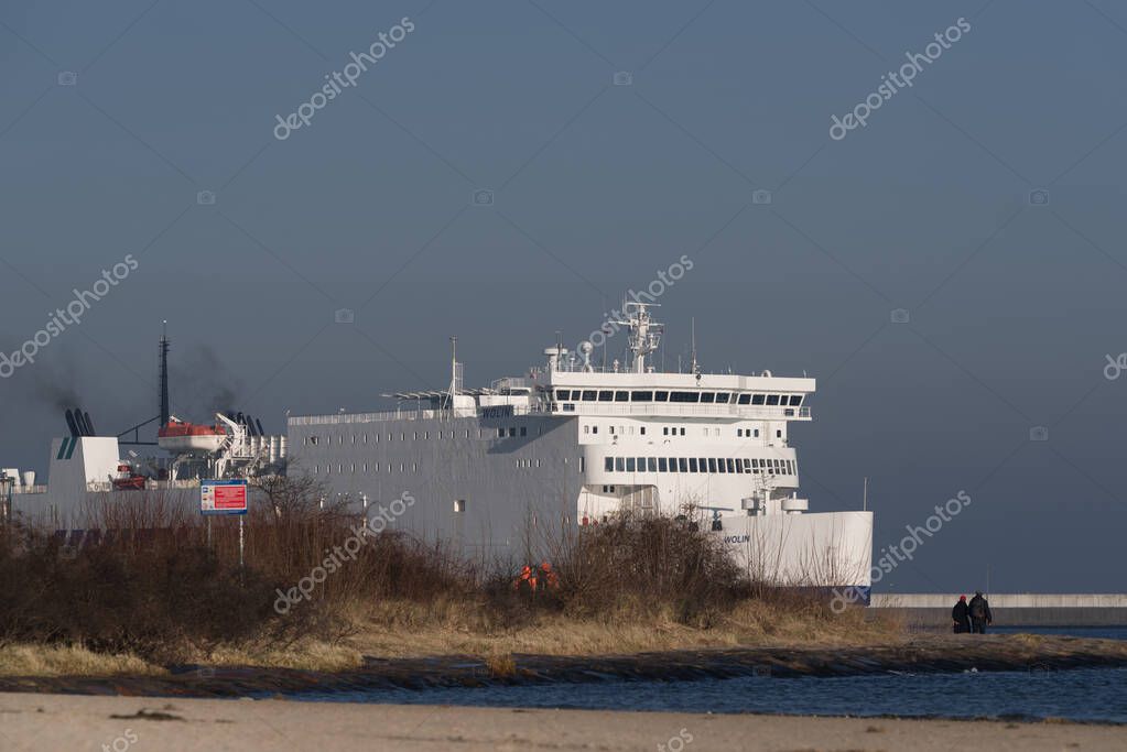 SWINOUJSCIE, WEST POMERANIAN - POLAND - JANUARY 20, 2025: Passenger and car ferry sails to the seaport