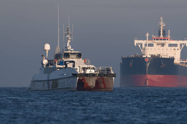 MARITIME TRANSPORT - Offshore tug/supply ship and bulk carrier sailing to sea port