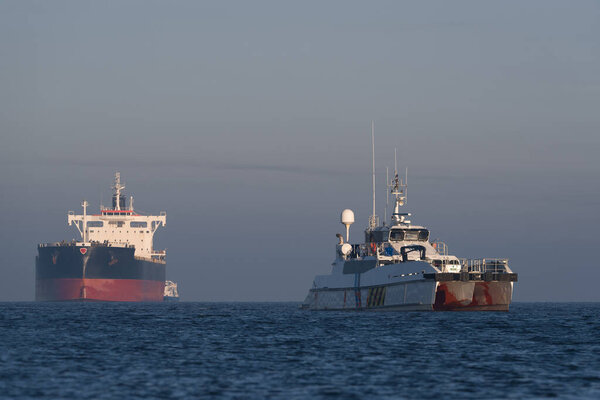 MARITIME TRANSPORT - Offshore tug/supply ship and bulk carrier sailing to sea port