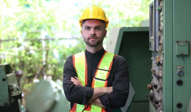 Young Engineer Working with big machine. 