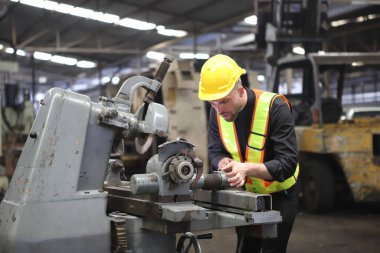 Young Engineer Working with big machine. 