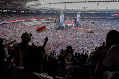 Jakarta, Indonesia - April 13, 2019: Crowd of Jokowi supporters in the Gelora Bung Karno Stadium in final rally of presidential election clipart