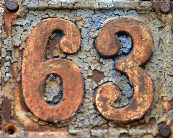 stock image Vintage grunge square metal rusty plate of number of street address with number. Close up, brand.