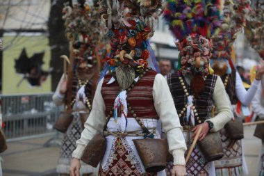 Pernik, Bulgaria - January 27, 2023: International masquerade festival Surva in Pernik, Bulgaria. People with mask called Kukeri dance and perform to scare the evil spirits.