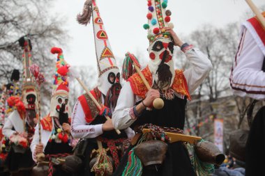 Pernik, Bulgaria - January 28, 2023: International masquerade festival Surva in Pernik, Bulgaria. People with mask called Kukeri dance and perform to scare the evil spirits.