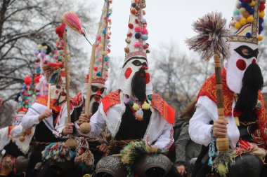 Pernik, Bulgaria - January 28, 2023: International masquerade festival Surva in Pernik, Bulgaria. People with mask called Kukeri dance and perform to scare the evil spirits.